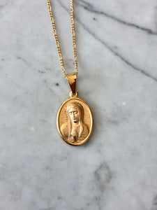 Medalla rostro VG chapa de oro